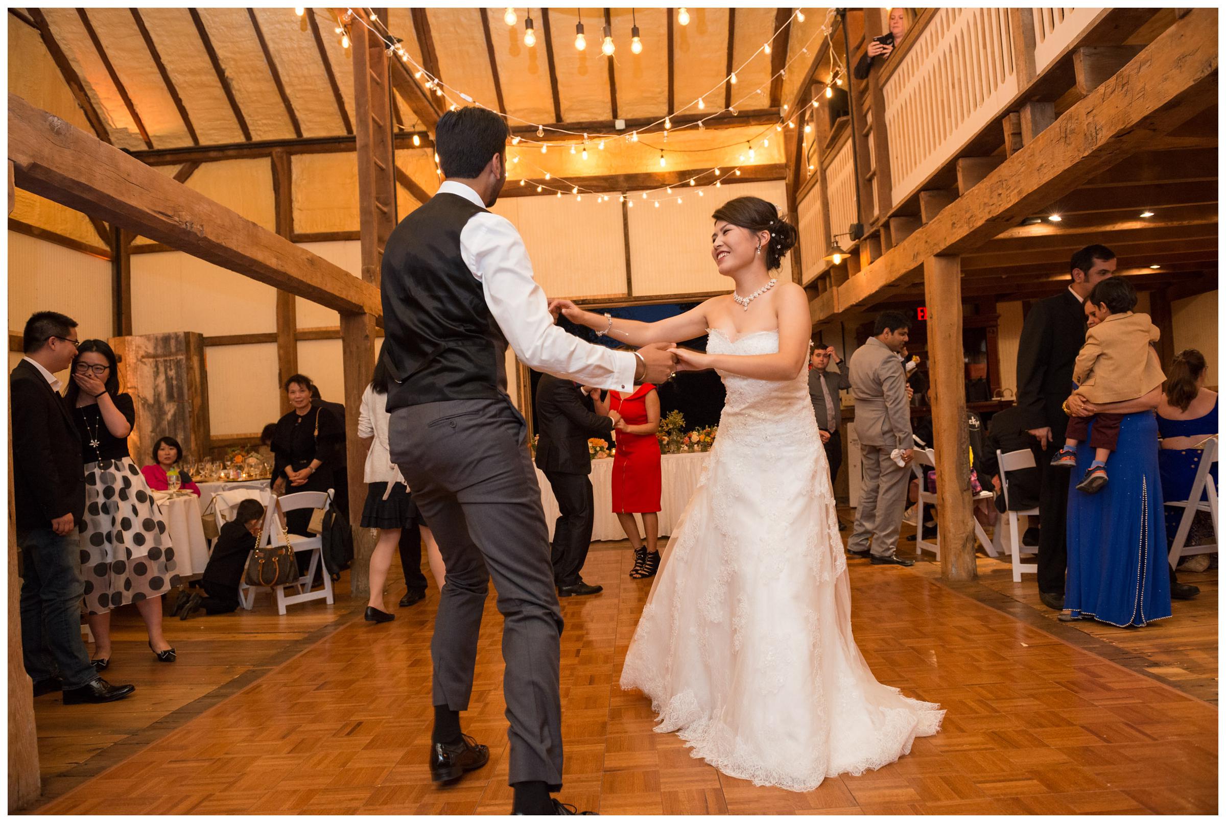 Bride and groom dancing during their rustic barn wedding reception in Northern Virginia.