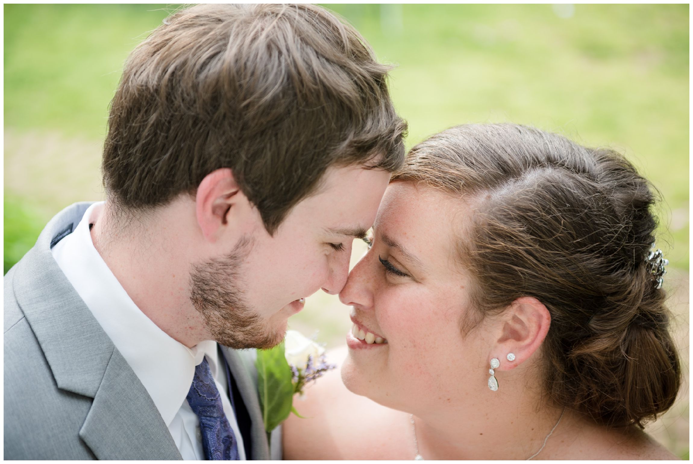 bride and groom snuggling on wedding day