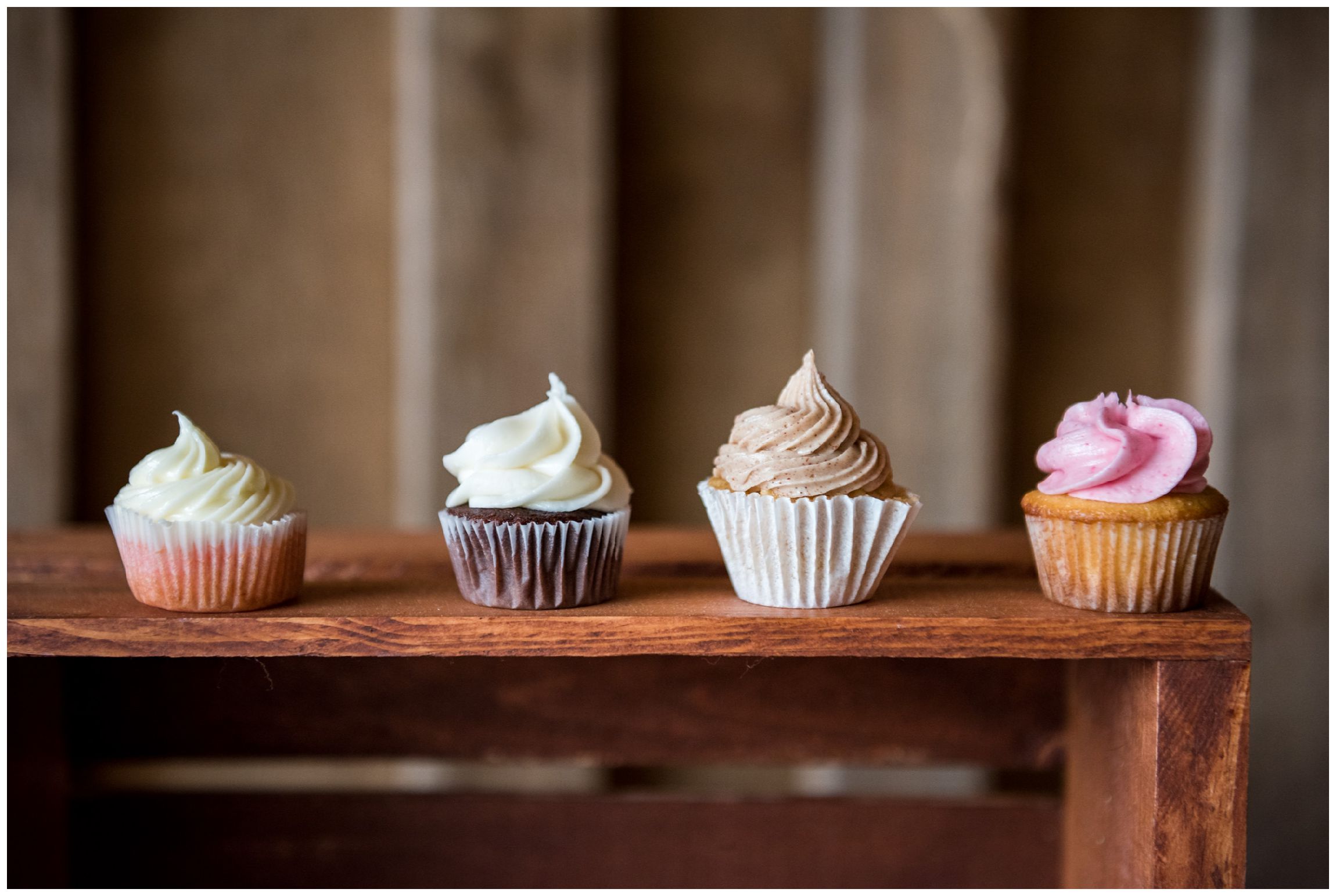 wedding cupcakes on wooden crate
