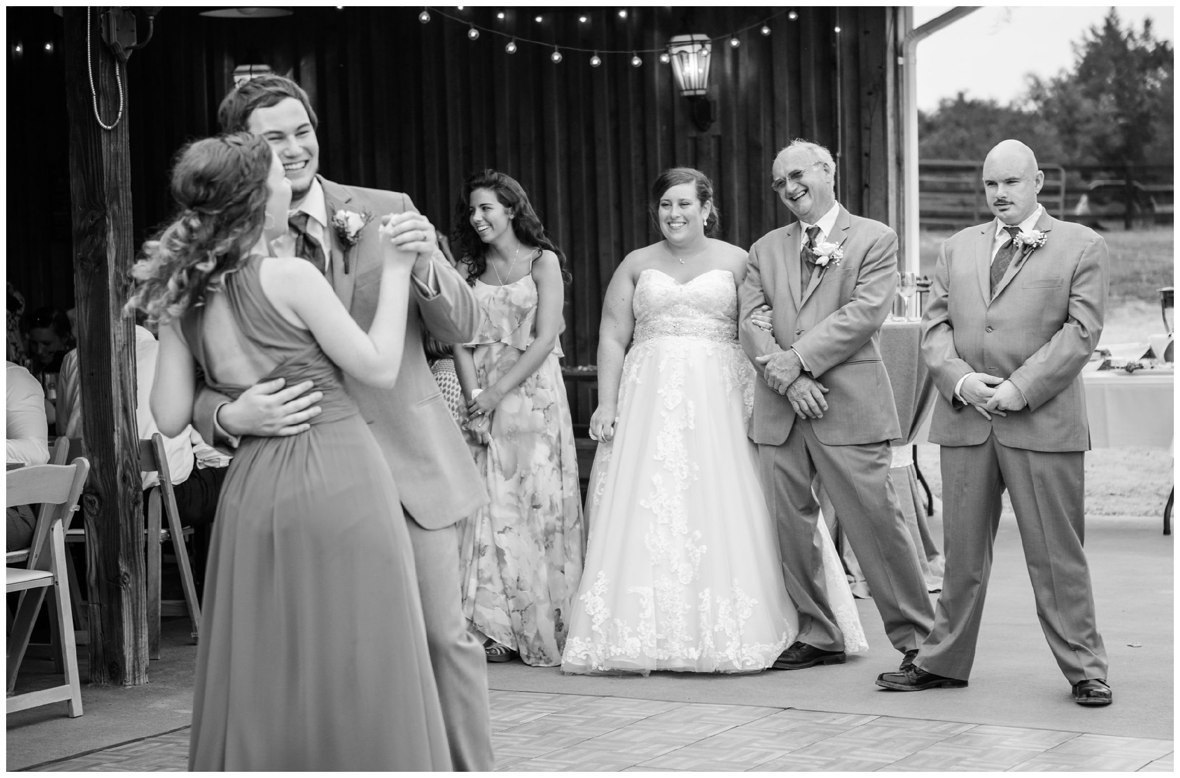 groom and sister dance at rustic barn wedding in Virginia