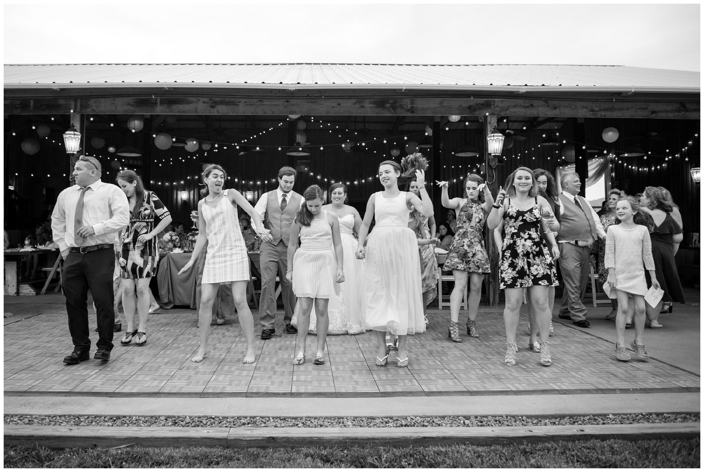 guests dancing at wedding reception in barn at Wolftrap Farm