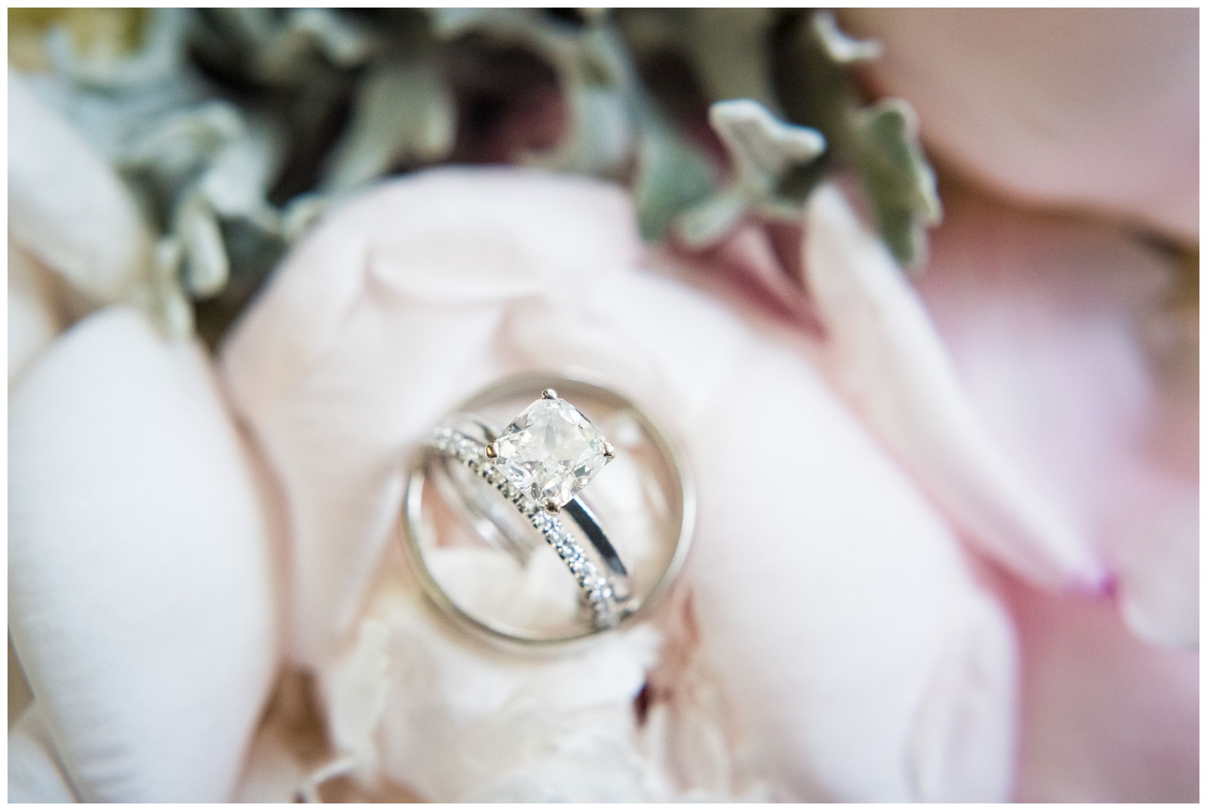 wedding rings on blush peony wedding bouquet