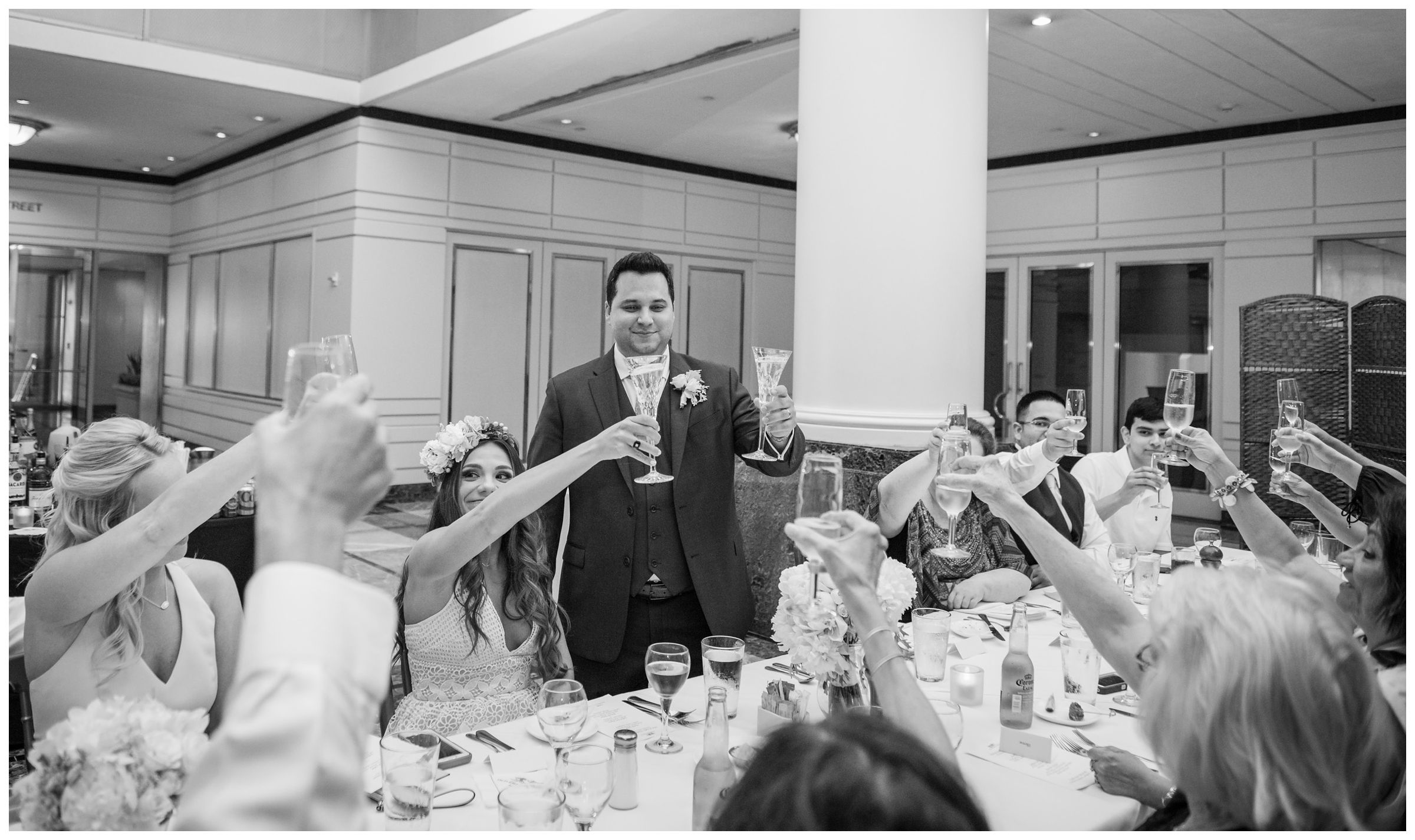 bride and groom toasting during intimate wedding reception dinner at Old Ebbitt Grill in Washington, D.C.