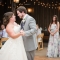 bride and groom first dance candid by rustic barn wedding photographer