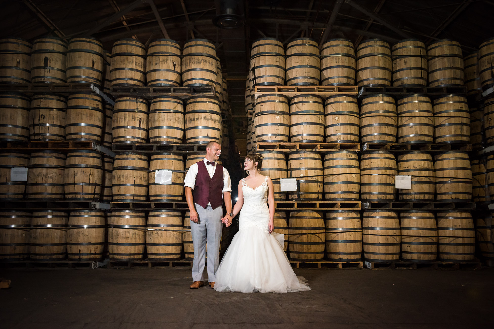 distillery wedding portrait with barrels