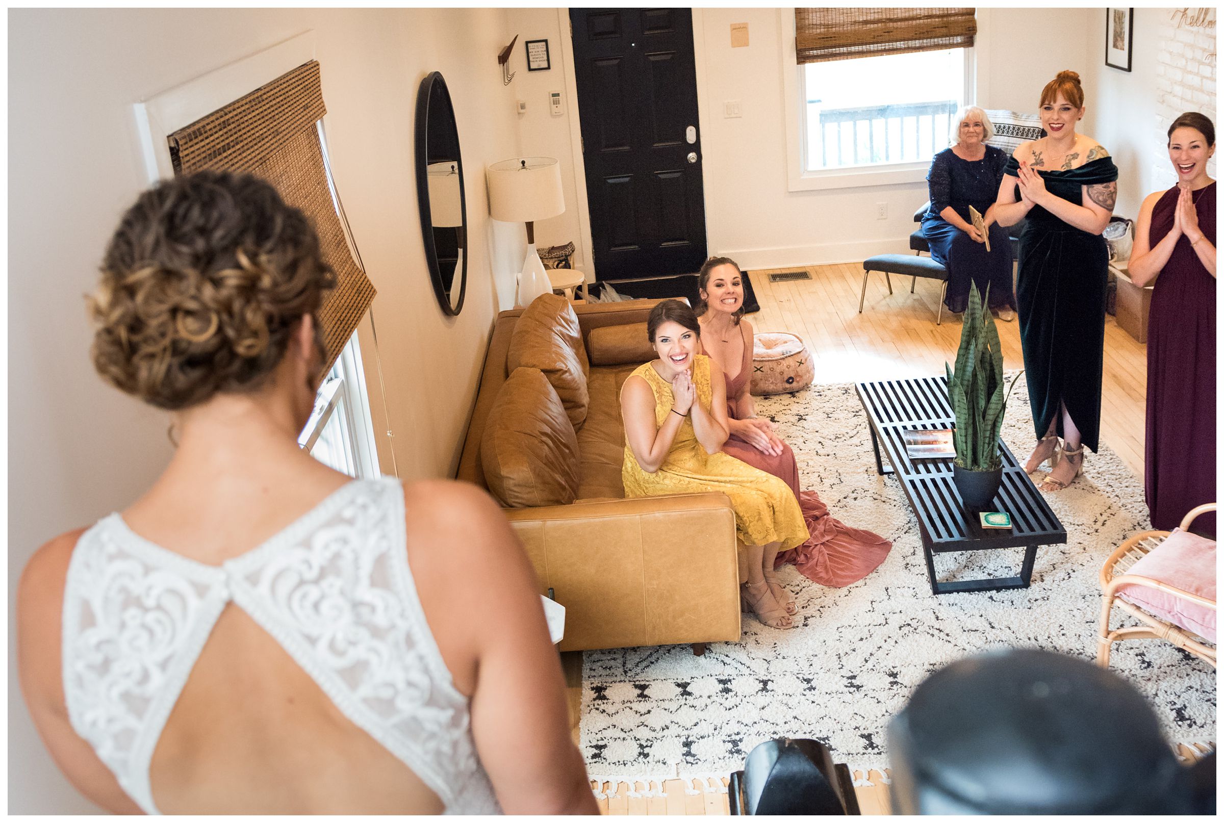 bridesmaids react to seeing bride in her wedding dress for the first time in Columbus, Ohio