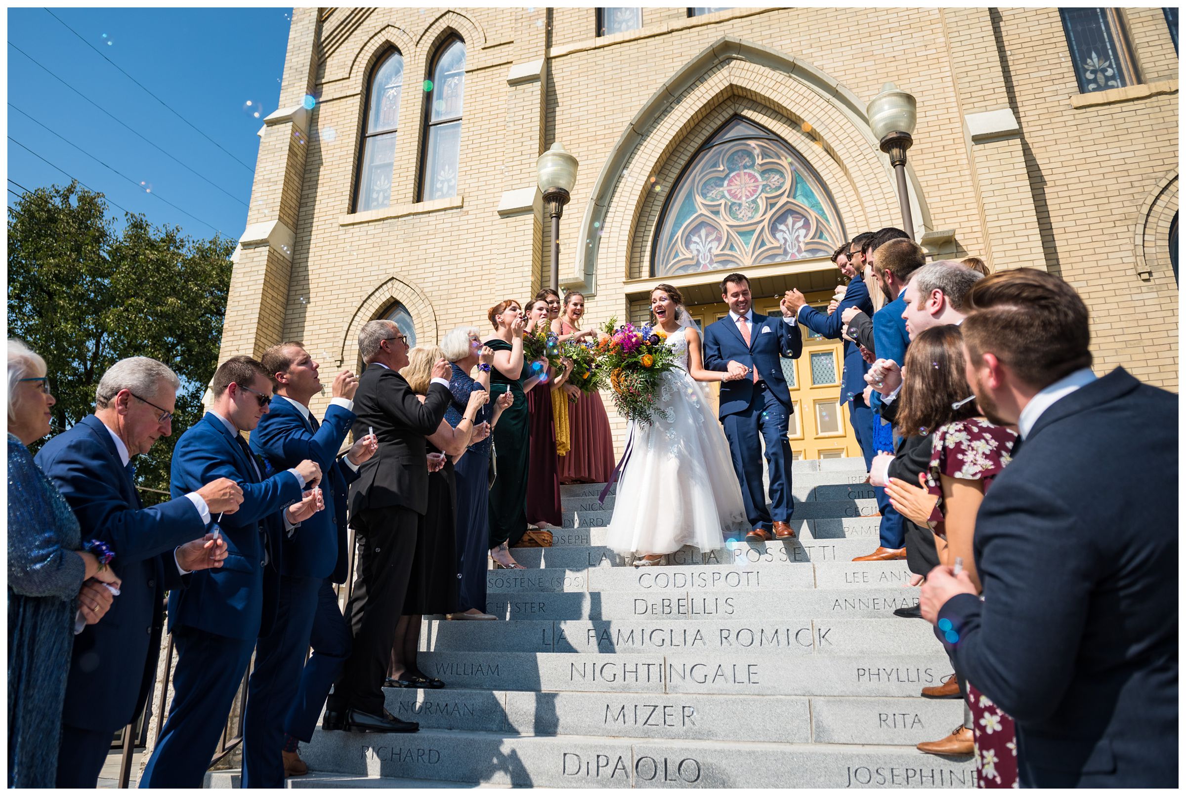 bubble exit on stairs after wedding ceremony at St. John the Baptist Catholic Church in downtown Columbus, Ohio