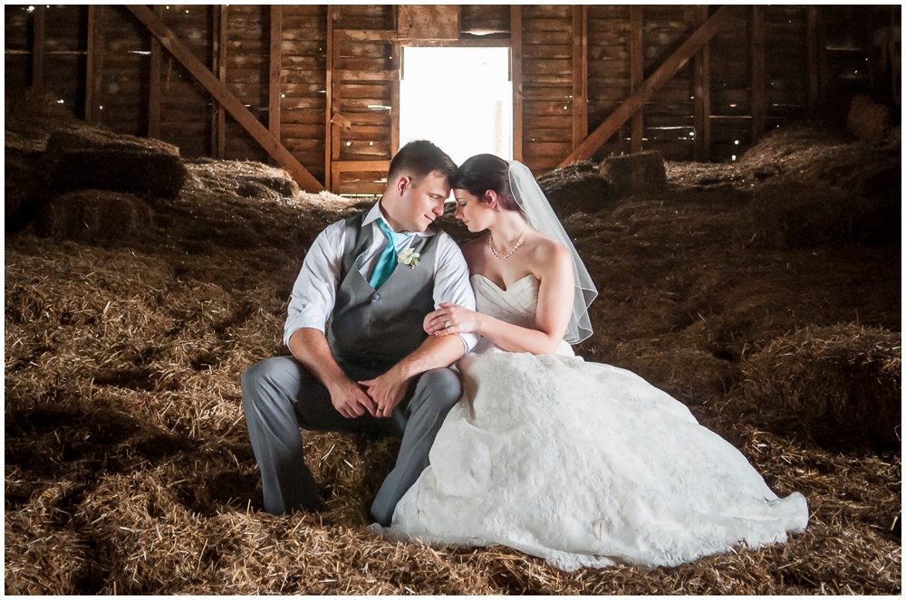 bride and groom portrait in barn