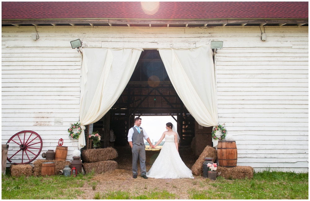 bride and groom portrait in rustic barn wedding