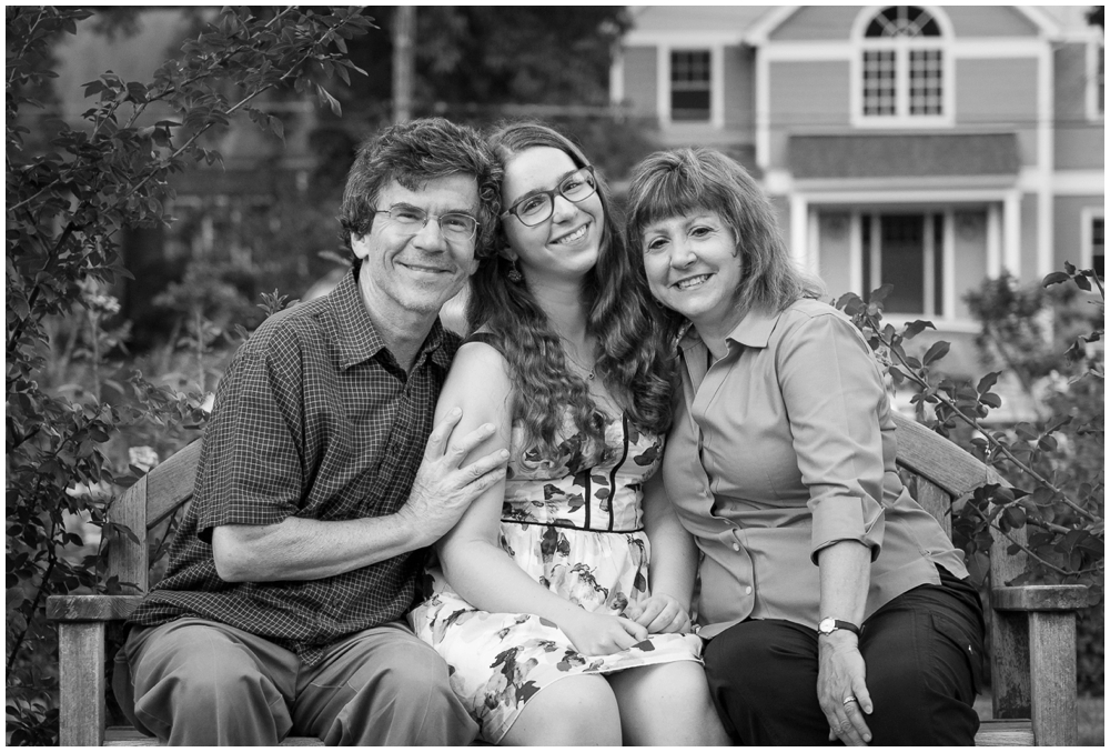 black and white family portrait in rose garden