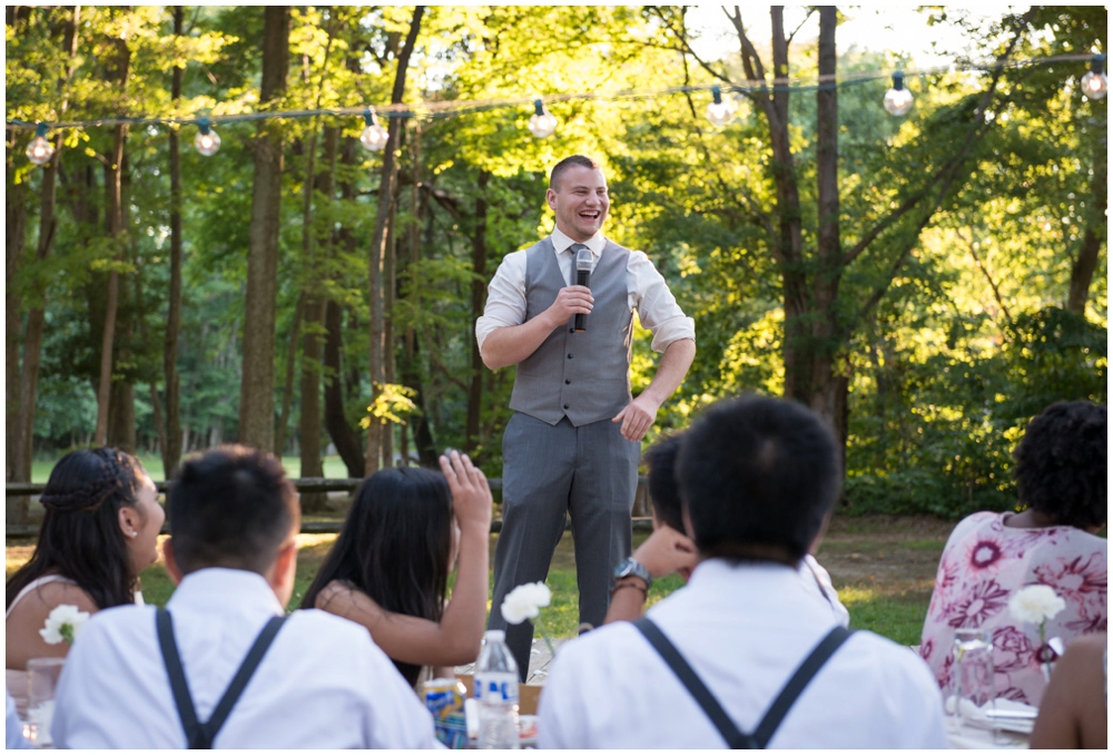 best man giving wedding toast at reception