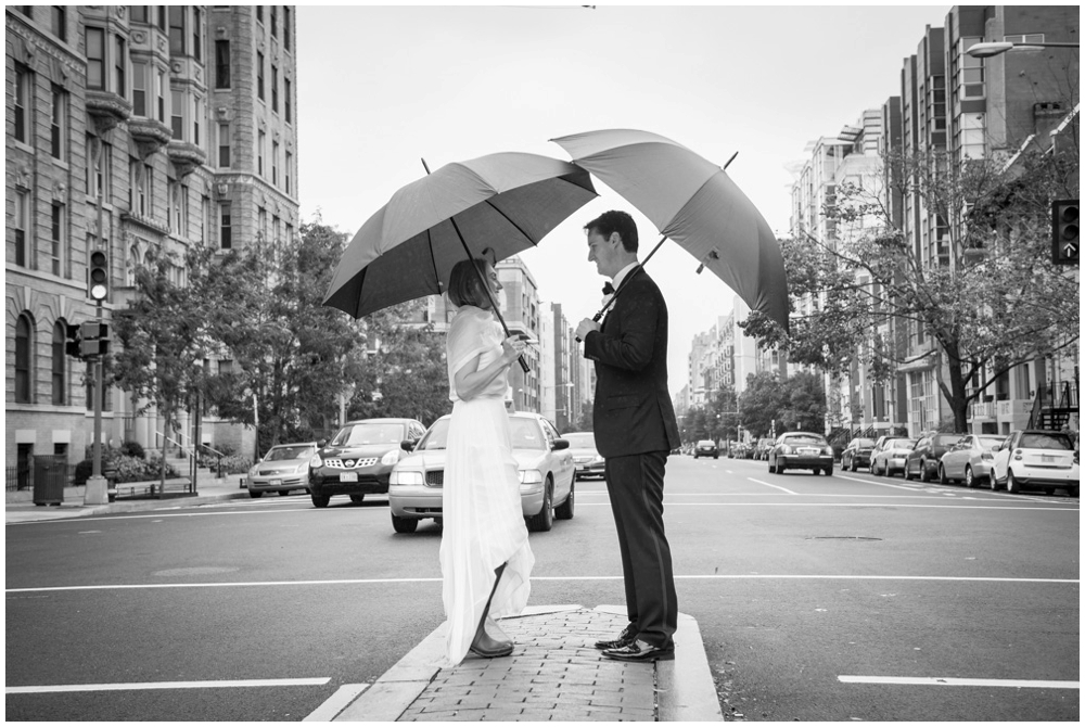 bride and groom portrait with umbrellas