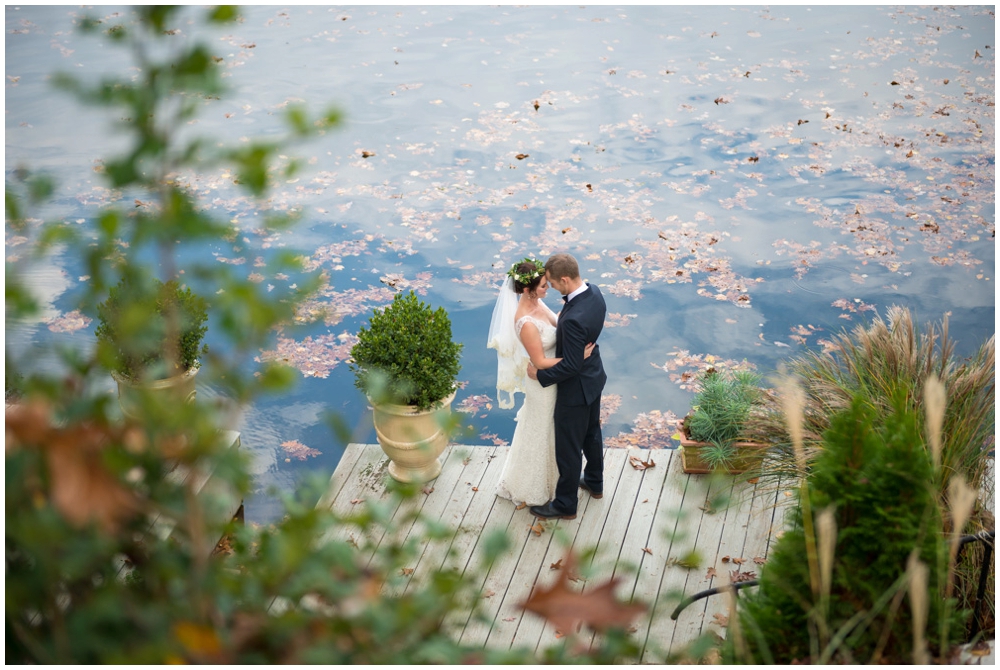 bride and groom portrait by lake