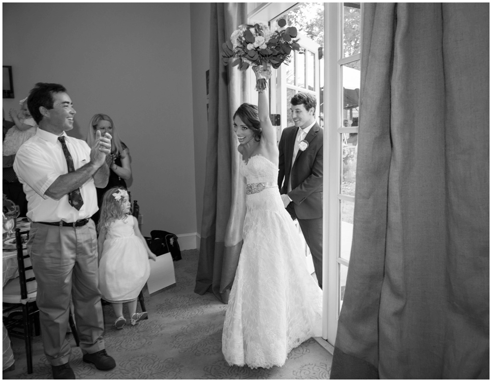 bride and groom entering wedding reception