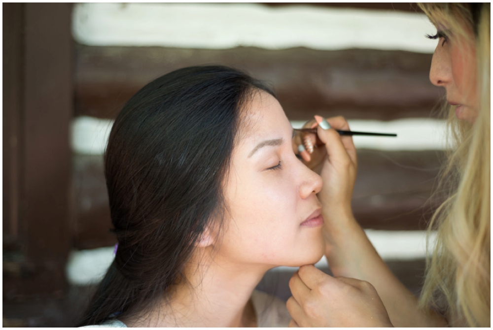 bride putting on makeup