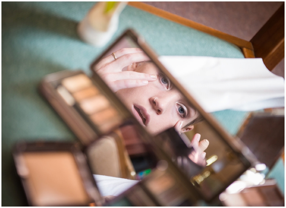 bridesmaid putting on makeup