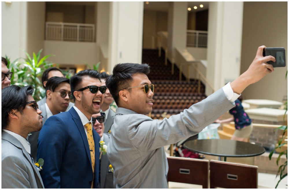 groomsmen taking selfie