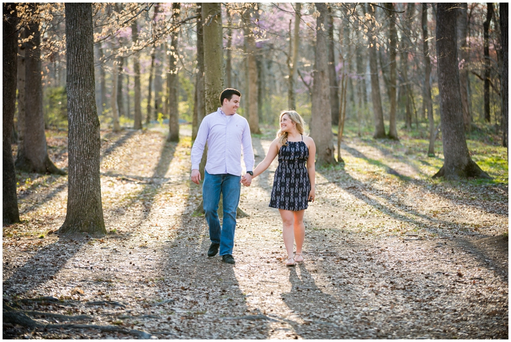 engaged couple at park with trees