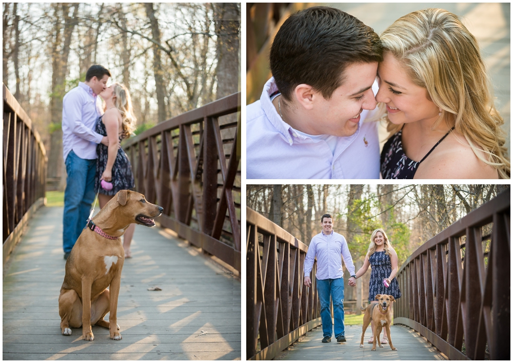 engaged couple with dog at park on bridge