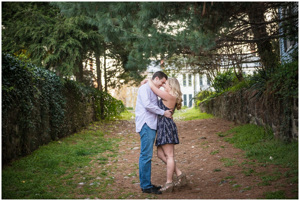 engaged couple in cobblestone alley