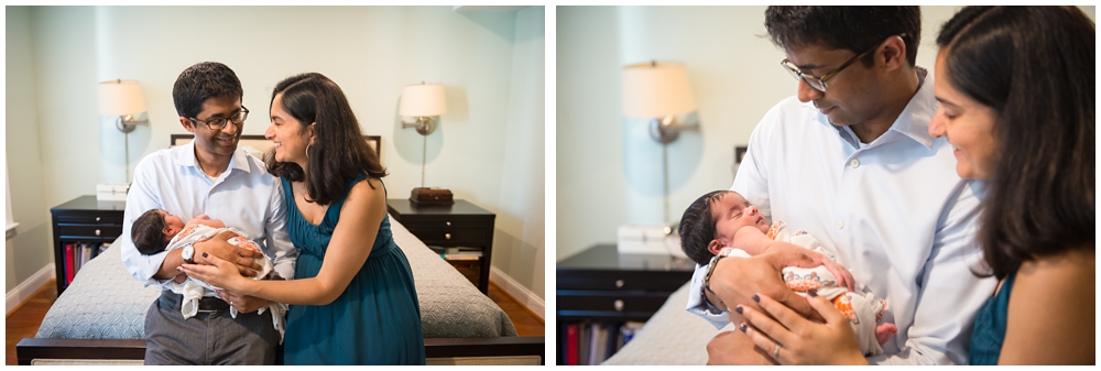 parents with newborn baby girl in home