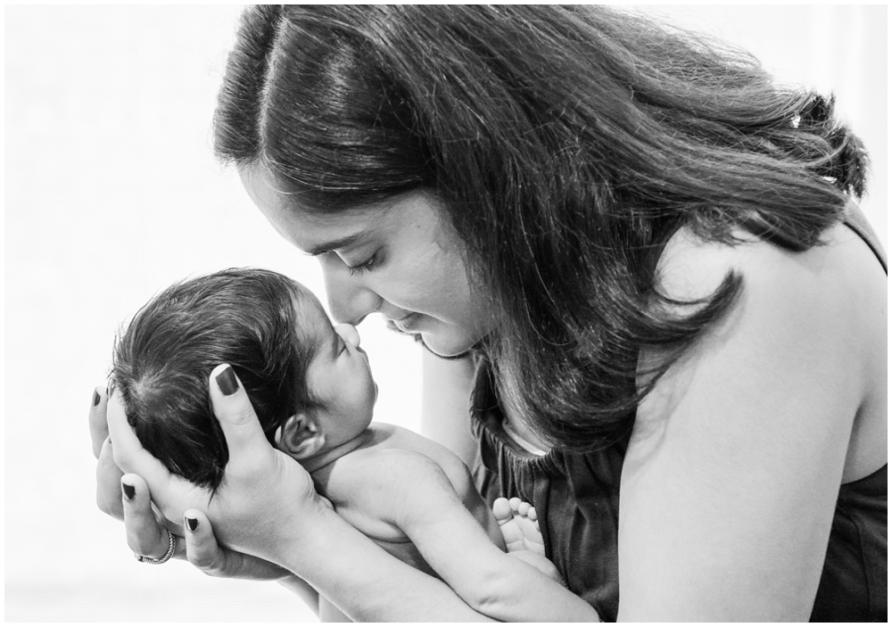 mom with newborn baby girl in home