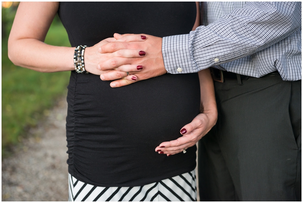 pregnant belly with clasped hands