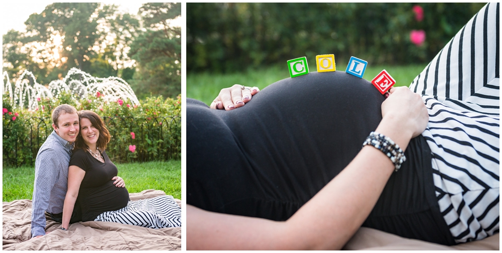 pregnant couple in park with fountain and alphabet blocks