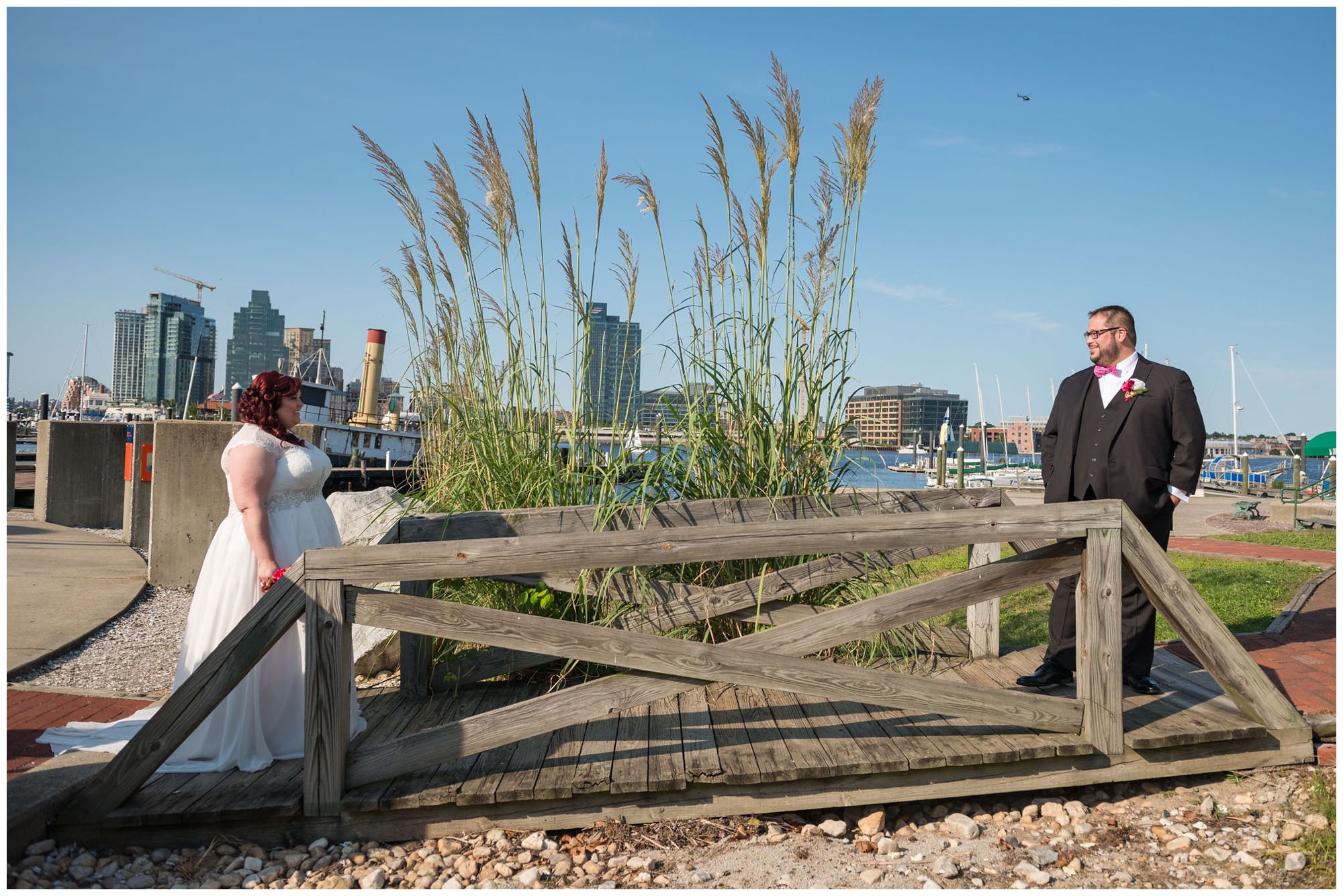 First look between bride and groom on Baltimore inner harbor