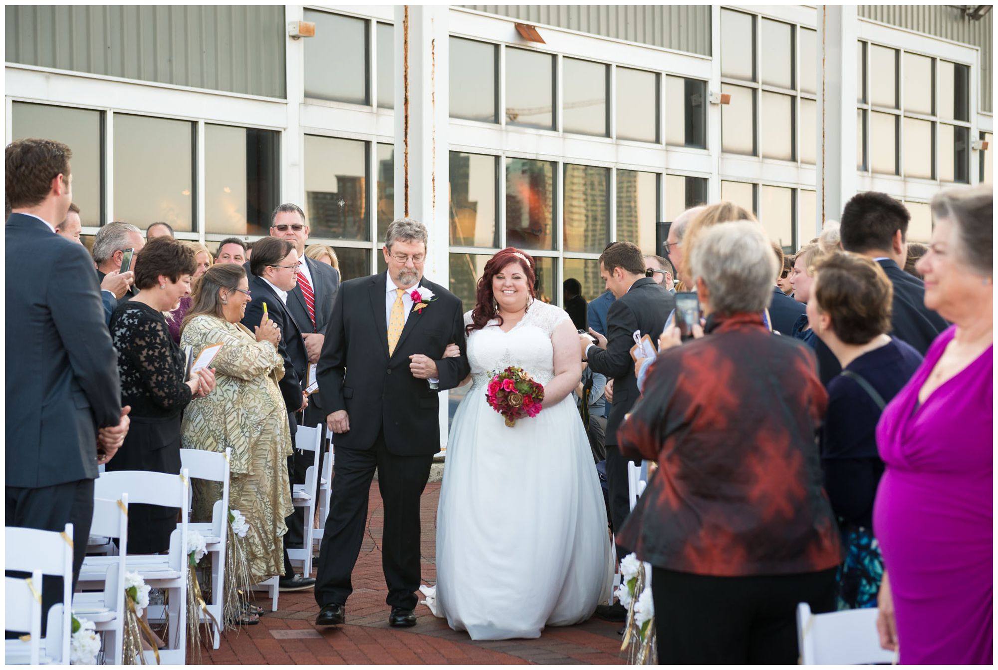 Bride entering with dad during harbor wedding at Baltimore Museum of Industry