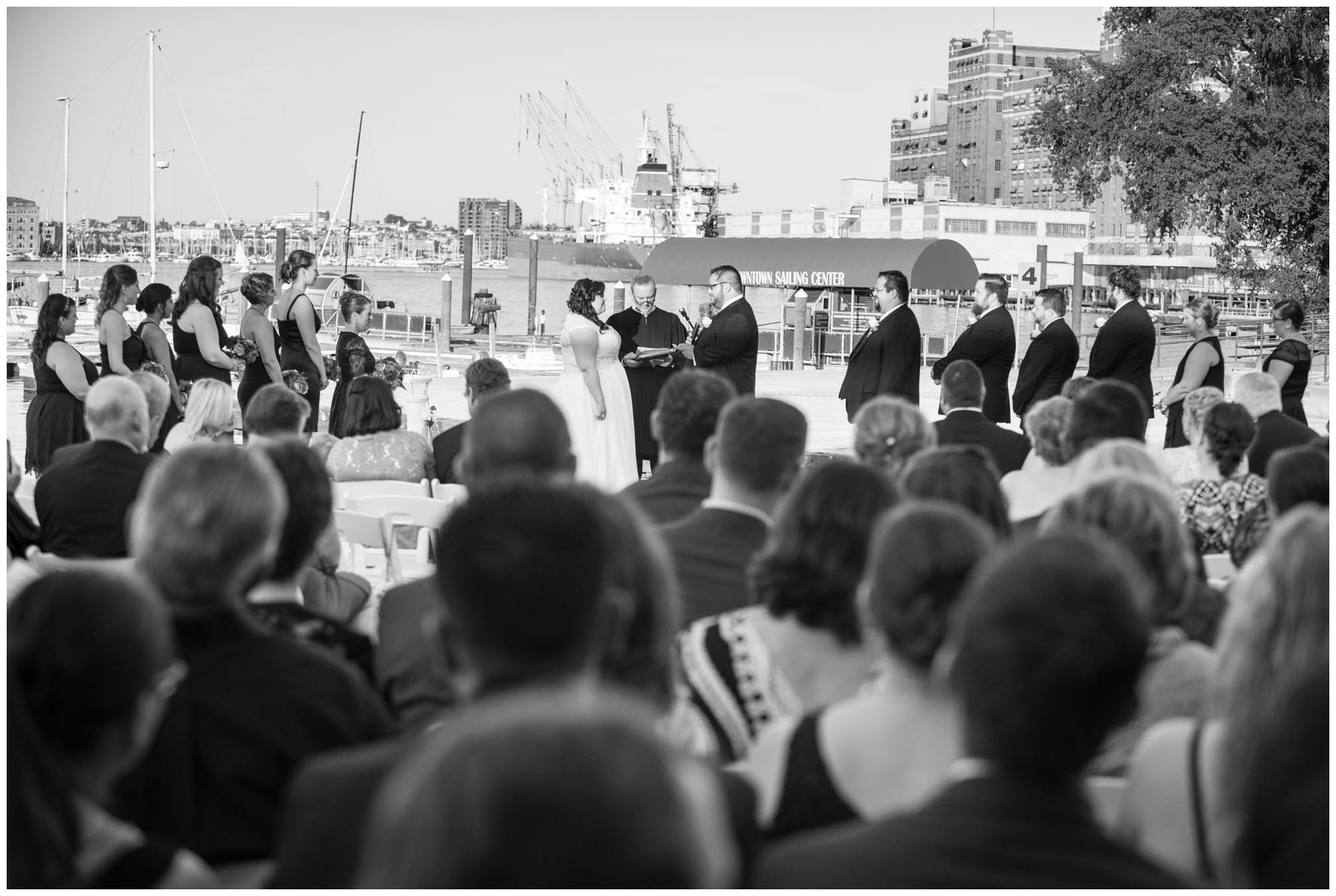 Bride and groom exchanging vows during harbor wedding at Baltimore Museum of Industry