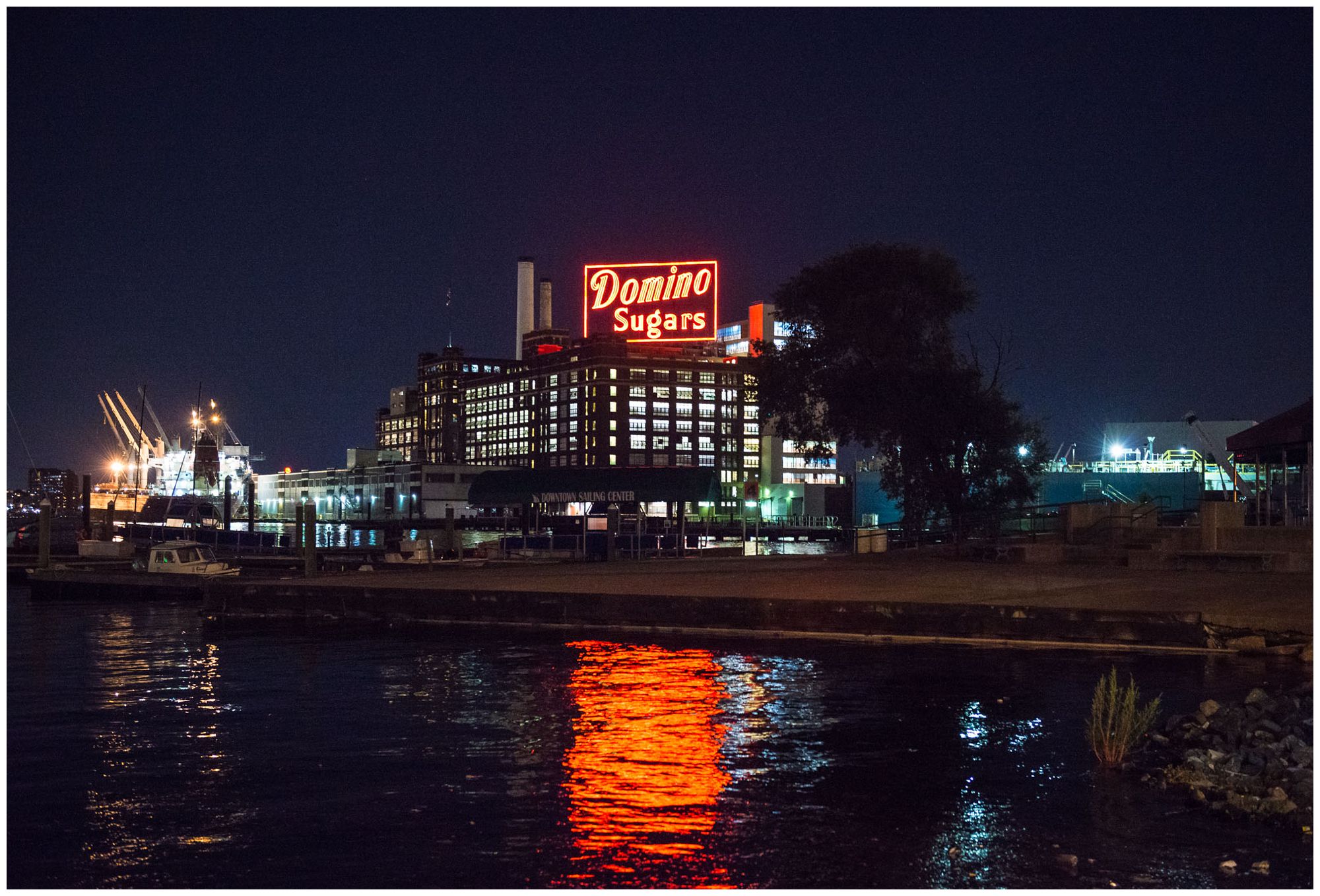 Domino Sugar factory at night in Baltimore Inner Harbor