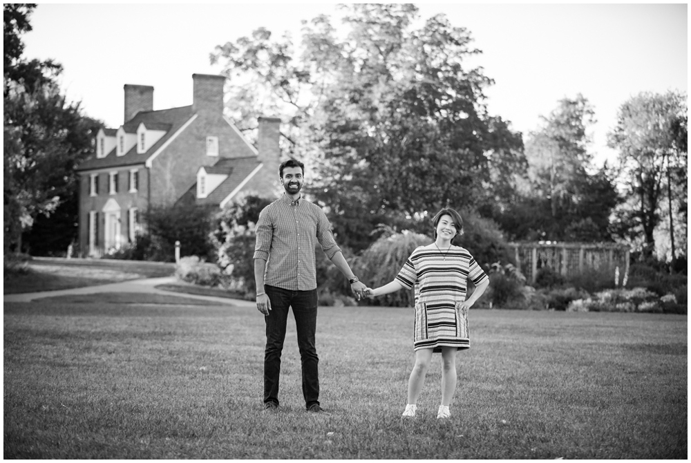 Engaged couple portrait in front of historic manor house at Green Spring Gardens in Alexandria, Virginia