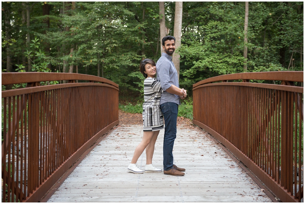 Engaged couple on bridge at Green Spring Gardens in Alexandria, Virginia