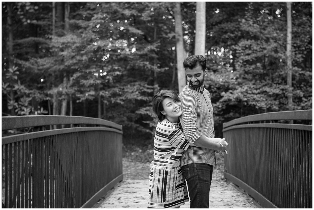 Engaged couple on bridge at Green Spring Gardens in Alexandria, Virginia