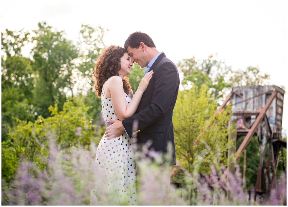 engaged couple embracing near lavendar