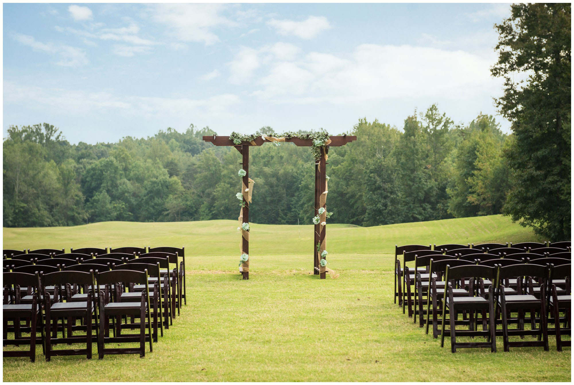 wedding ceremony setup with arch at golf club