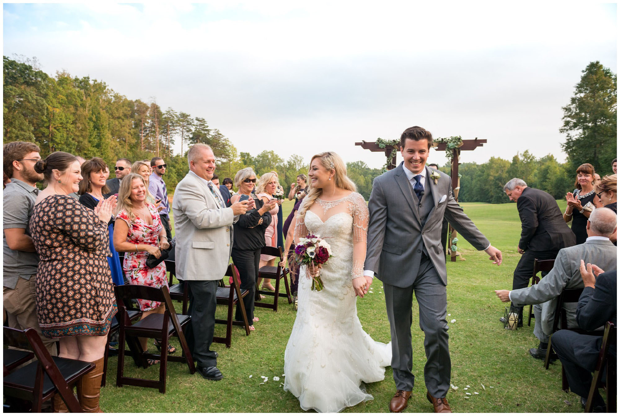 bride and groom exiting wedding ceremony