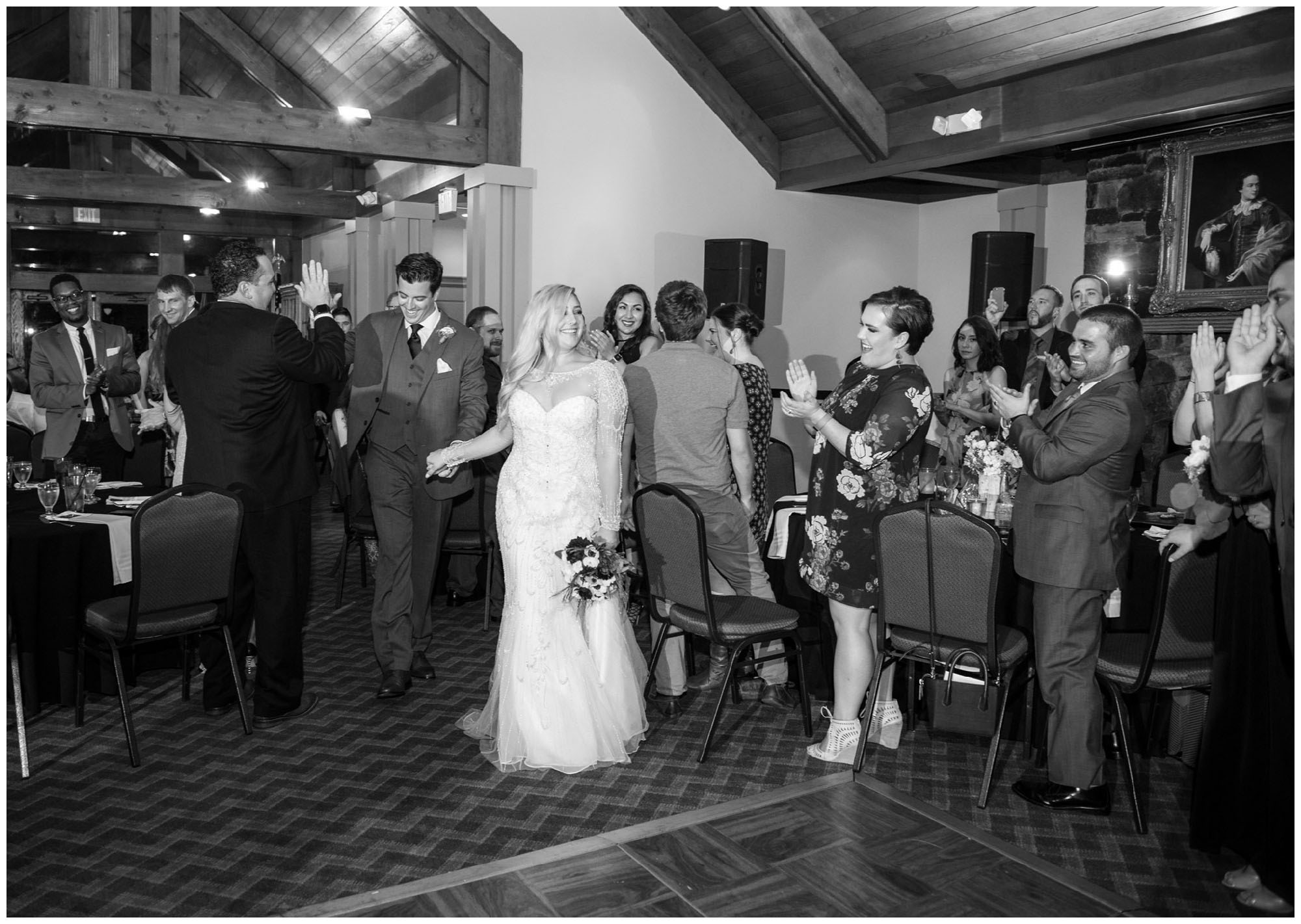 bride and groom entering reception