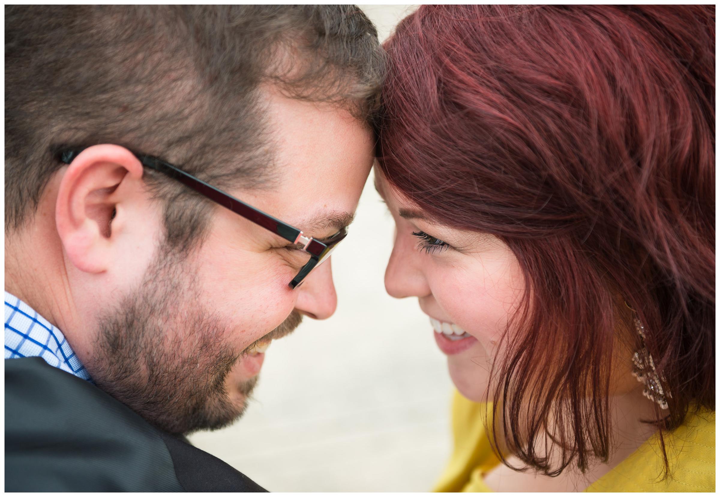 closeup of engaged couple forehead to forehead