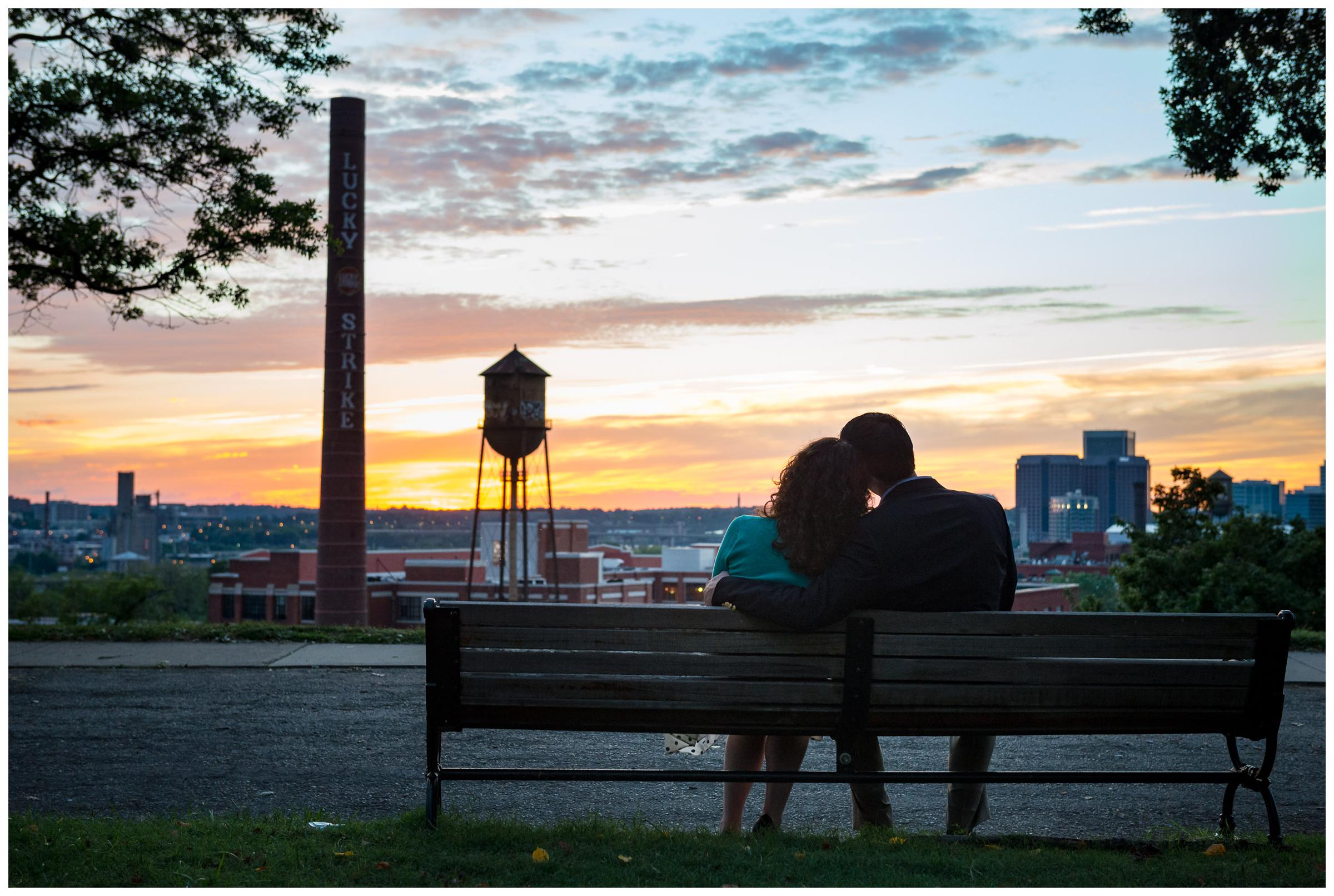 engaged couple on bench at sunset in Richmond Virginia