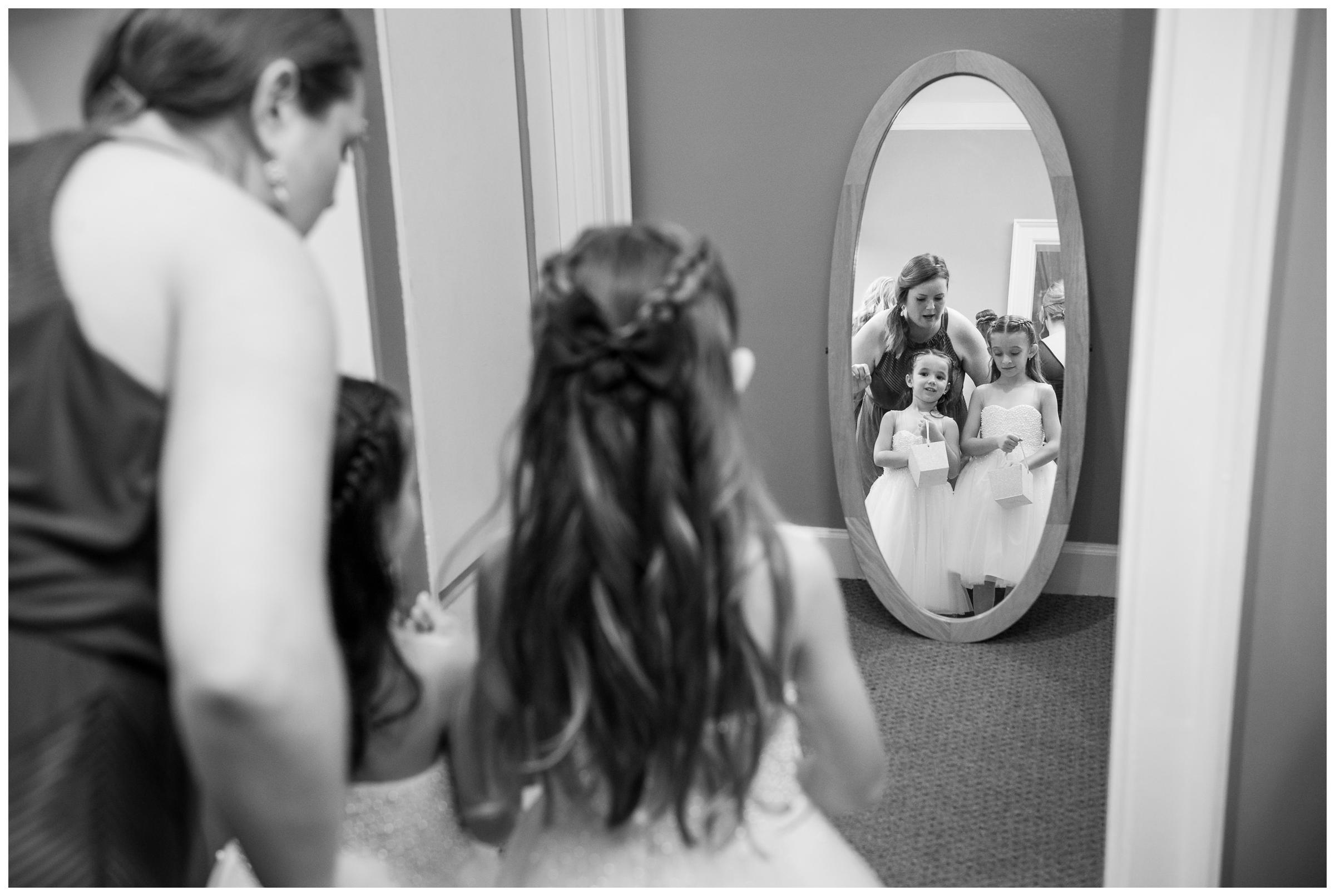 flower girls getting ready before wedding ceremony