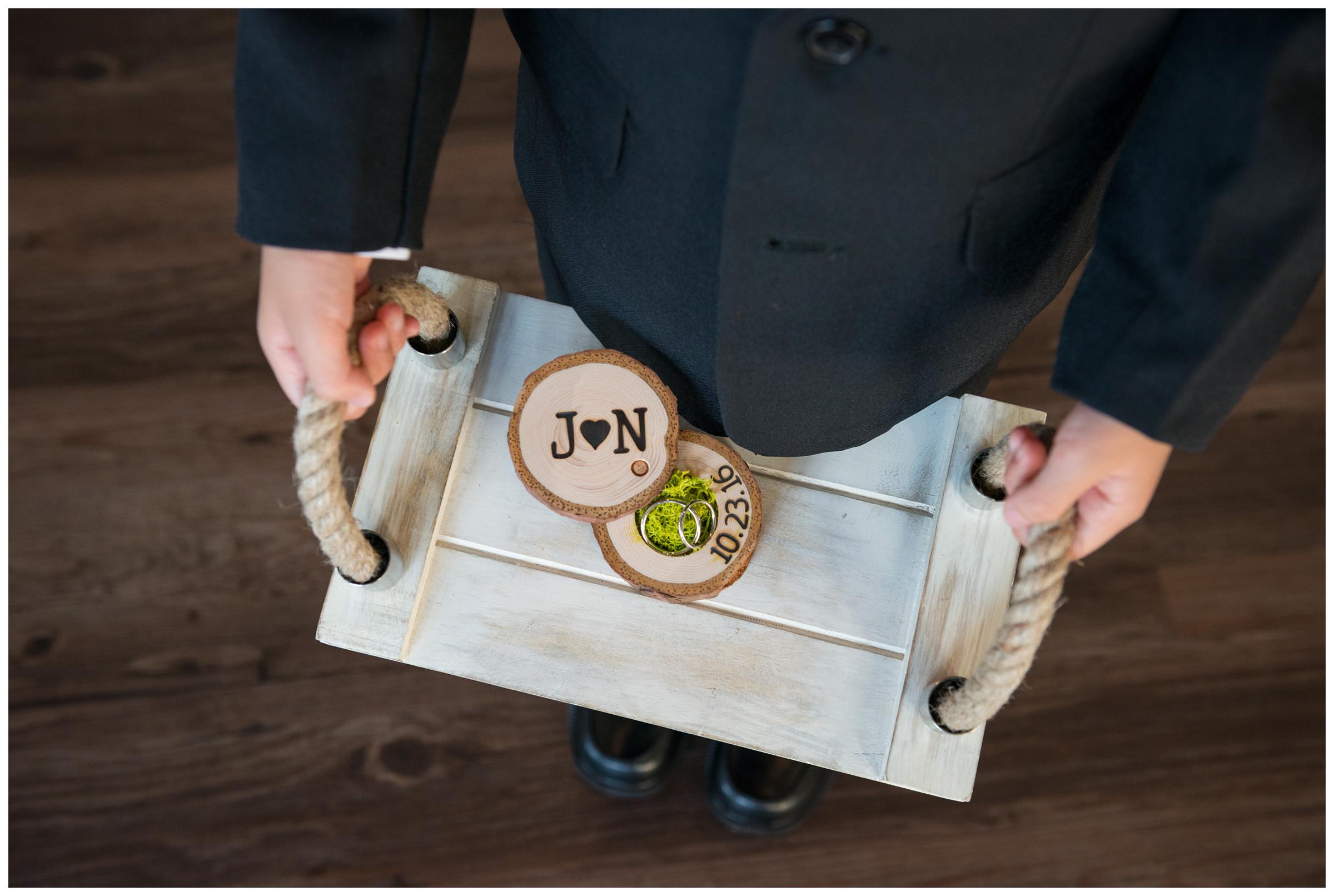 ring bearer holding rings in wooden box