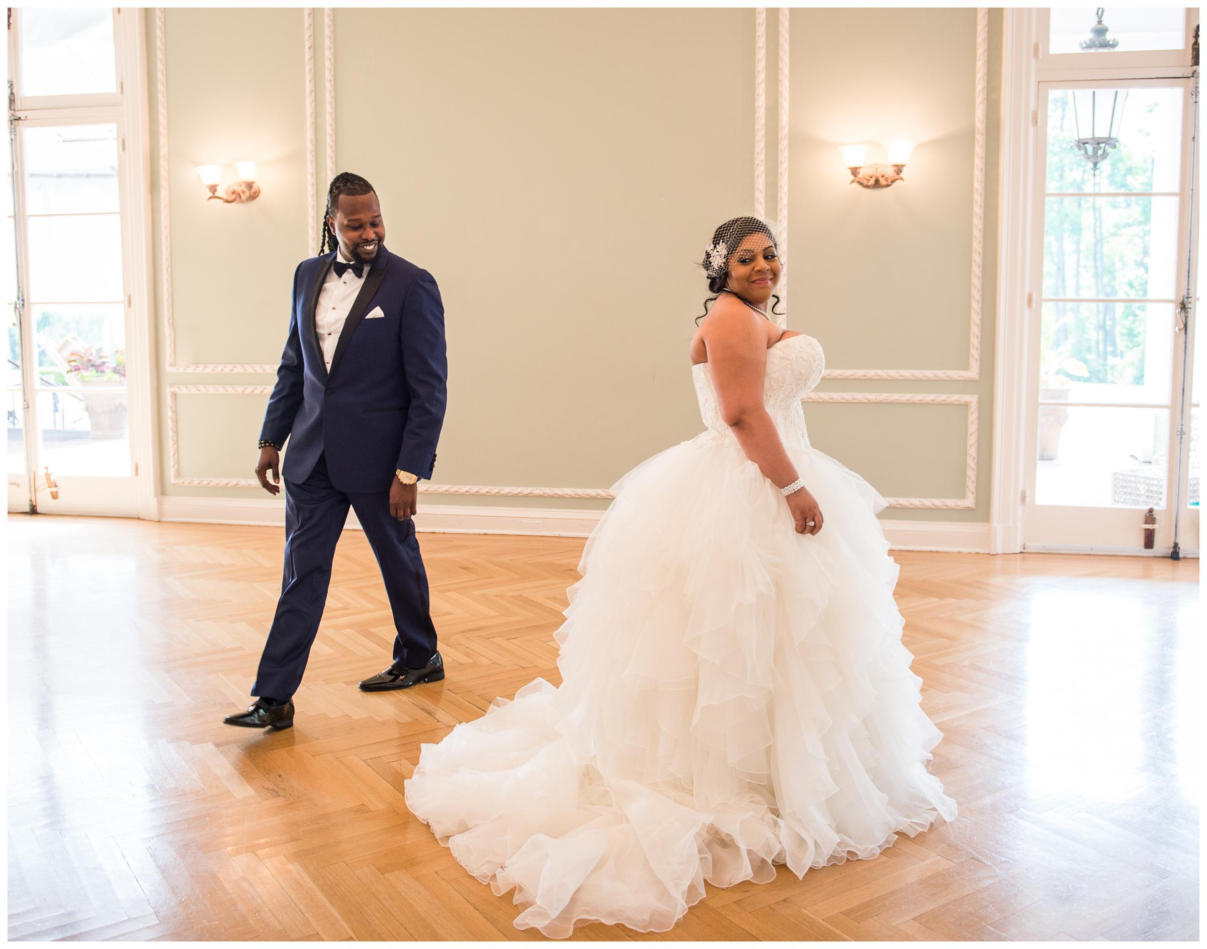 bride and groom showing excitement during first look at Oxon Hill Manor in Maryland