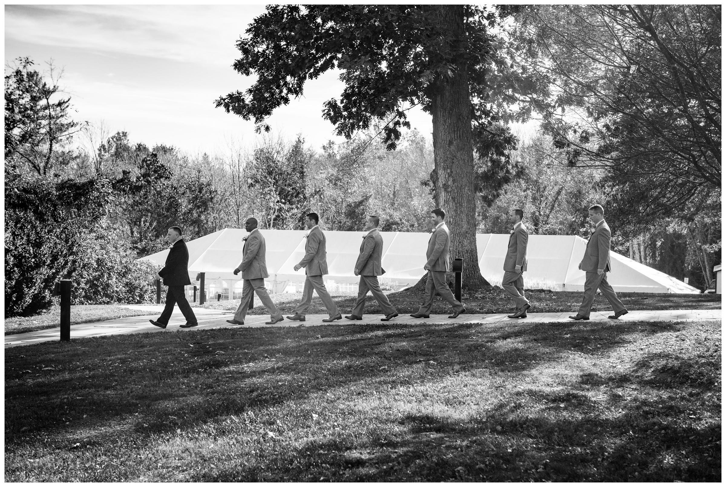 groomsmen entering wedding ceremony at Rust Manor in Leesburg, Virginia