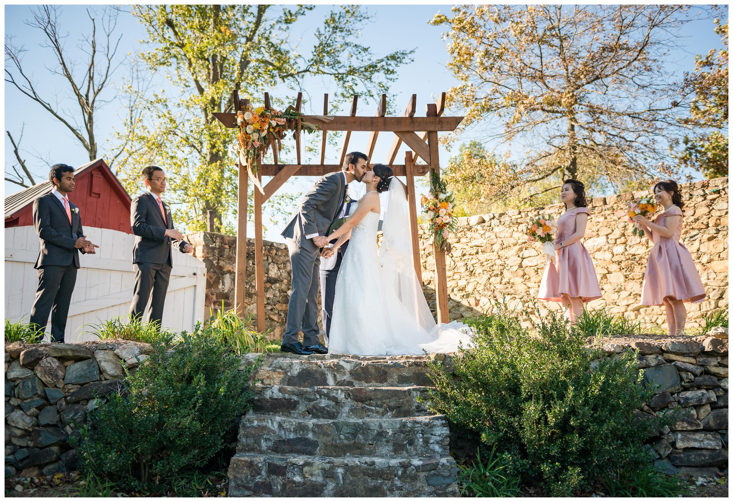 first kiss during wedding ceremony at Stoneleigh Golf and Country Club in Virginia