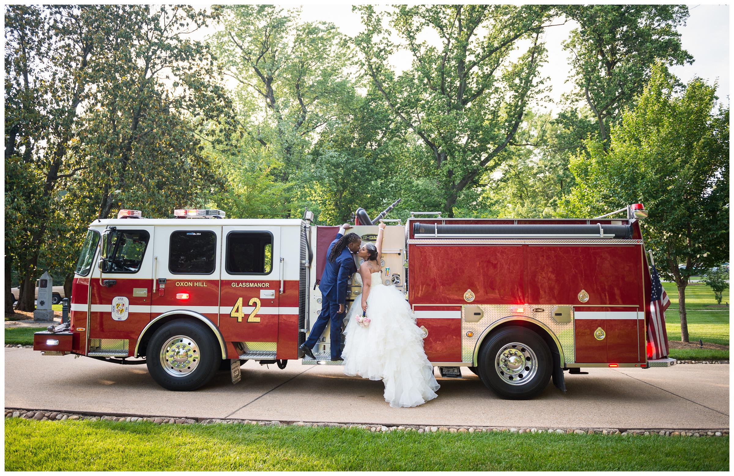 bride and groom portrait on fire truck