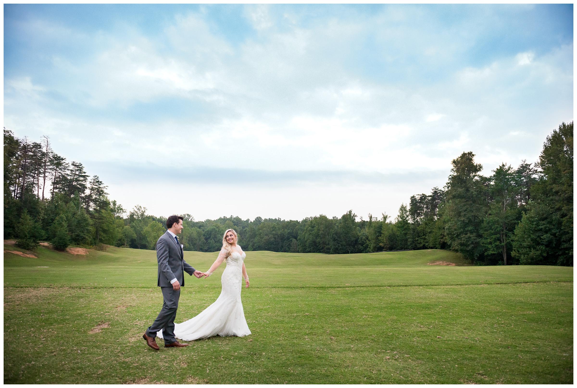 bride and groom in field