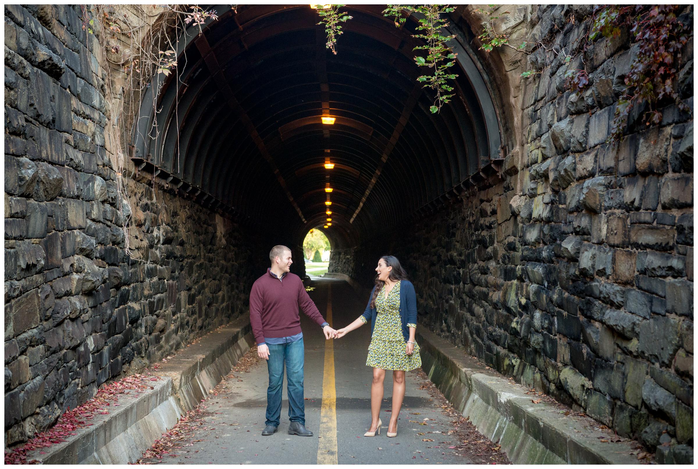 engaged couple at Wilkes Street pedestrian tunnel in Old Town Alexandria, Virginia