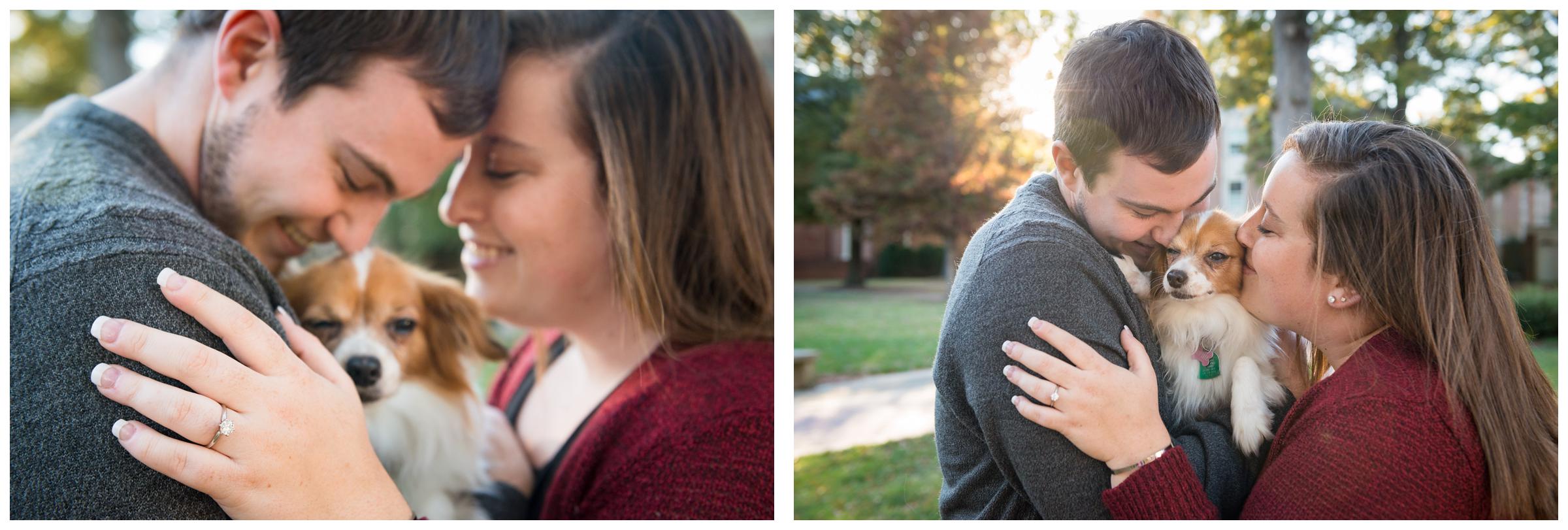 Engaged couple snuggling with dog.